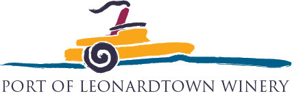 Exterior view of Port of Leonardtown Winery with vineyard and building in the background.