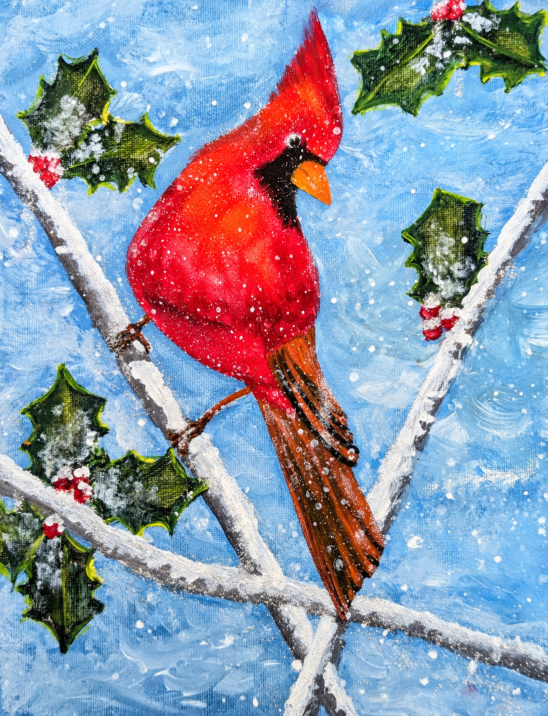 Colorful cardinal perched on snow-covered branch with holly leaves and berries in winter scene.